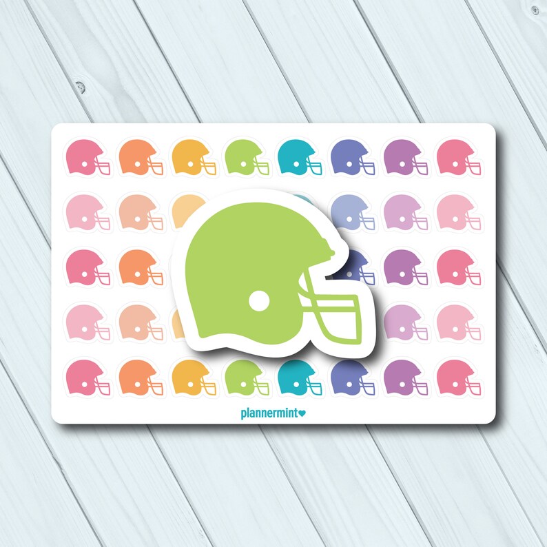 May include: A sheet of football helmet stickers in pink, orange, yellow, green, teal, purple, and blue. A large lime green helmet sticker is centered on the sheet. The text "plannermint" is at the bottom.