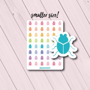 May include: A sheet of colorful beetle stickers in various colors, including pink, orange, yellow, green, blue, purple, and a turquoise beetle sticker. The text "smaller size!" is above the stickers. The brand name "plannermint" is at the bottom.