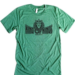 May include: Green t-shirt with a black graphic of a lion with a crown and the text "King of Kings" with the words "Revelation 19:16" underneath.