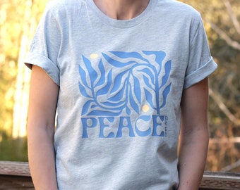 Peace John 14:27 Botanical Christian Shirt for Women in a unisex style with a Faith-Based Blue Floral and Bible Verse graphic