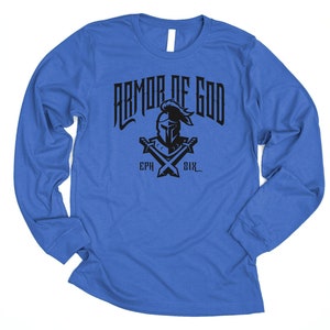 May include: A royal blue long-sleeved t-shirt with a black graphic of a knight's helmet with crossed swords and the text "Armor of God" and "Eph 6:11".