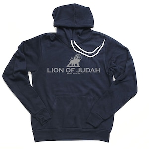 May include: A navy blue hooded sweatshirt with a white drawstring. The front of the sweatshirt features a gray lion graphic and the text "Lion of Judah Revelation 5:5".