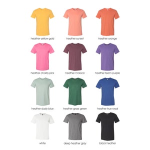 May include: A selection of 12 t-shirts in various colors, including heather yellow gold, heather sunset, heather orange, heather charity pink, heather maroon, heather team purple, heather dusty blue, heather grass green, heather true royal, white, deep heather gray, and black heather.