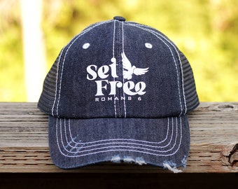 Set Free Dove distressed Christian trucker hat for women with Romans 6 Bible verse in an unstructured low profile denim baseball cap style