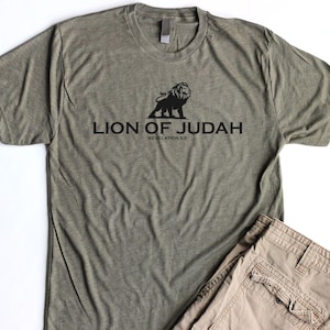 May include: A green t-shirt with a black lion graphic and the text "Lion of Judah Revelation 5:5".