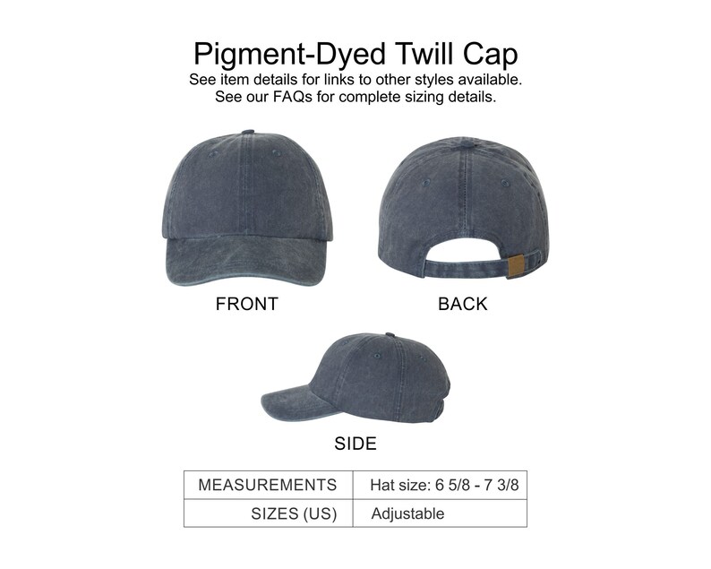 May include: A pigment-dyed twill cap in a dark blue color. The cap has an adjustable strap and is shown from the front, back, and side. Hat size: 6 5/8 - 7 3/8.
