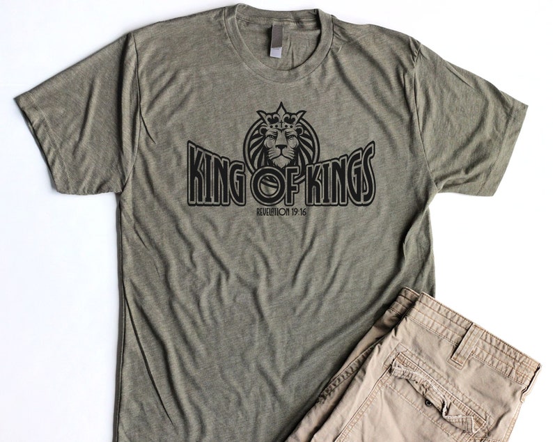 May include: A green t-shirt with a black graphic of a lion wearing a crown and the text "King of Kings" with the scripture reference "Revelation 19:16".