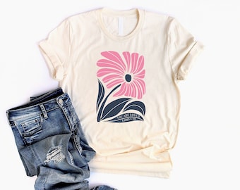 You Are Loved Christian Shirt for Women and Teen Girls in a unisex style with a Faith-Based Flower and 1 John 4:19 Bible Verse theme