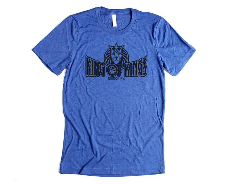 May include: A royal blue t-shirt with a black graphic of a lion wearing a crown and the text "King of Kings Revelation 19:16".
