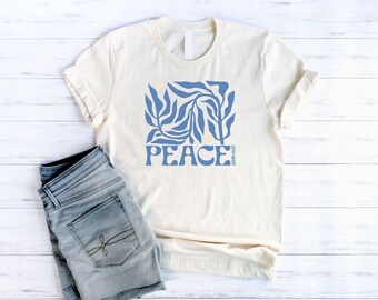 Peace John 14:27 Botanical Christian Shirt for Women in a unisex style with a Faith-Based Blue Floral and Bible Verse graphic