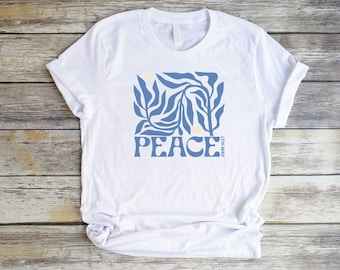 Peace John 14:27 Botanical Christian Shirt for Women in a unisex style with a Faith-Based Blue Floral and Bible Verse graphic