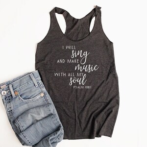 May include: A dark gray tank top with the text "I will sing and make music with all my soul Psalm 108:1" printed in white.