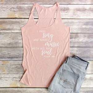 May include: A pink tank top with the text "I will sing and make music with all my soul Psalm 108:1" printed in white.