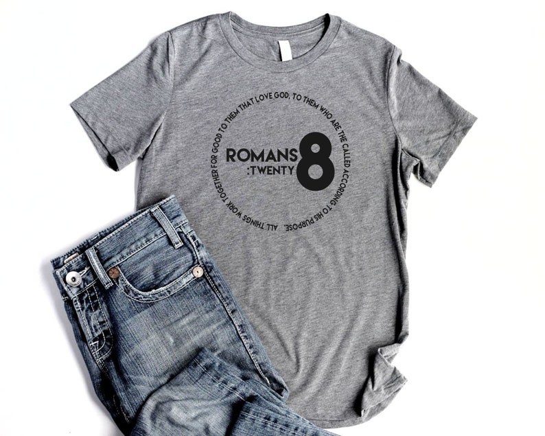 May include: Gray t-shirt with a black circle graphic that says "Romans 8:Twenty" and "All things work together for good to them that love God, to them who are the called according to His purpose."
