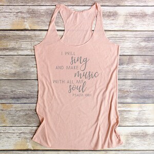 May include: A light pink tank top with the text "I will sing and make music with all my soul Psalm 108:1" printed on the front.