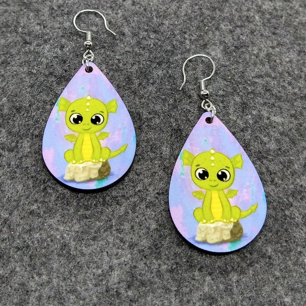 Darling Dragon Earrings Green Baby Dragon Perched on a Rock Pink Purple and Aqua Watercolor Background Adorable Little Lizard w/ Wings