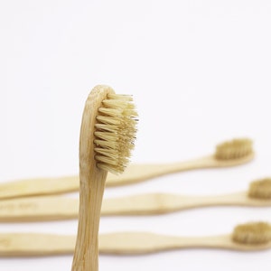 May include: Four natural bamboo toothbrushes with soft bristles. The toothbrushes are made from sustainable materials and are a great alternative to plastic toothbrushes.