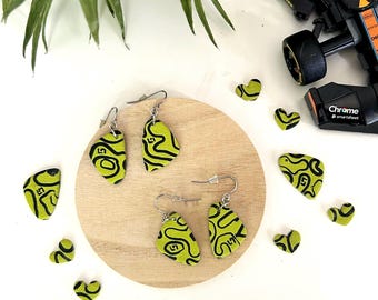 Lando Norris's helmet inspired handpainted earrings.