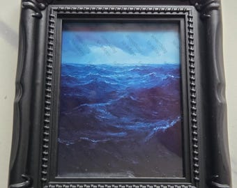 Small framed dark sea portrait