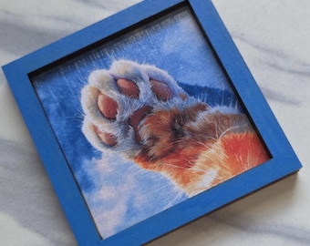 Miniature framed orange and white cat paw, 2X2 inches
