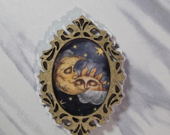 Miniature framed celestial sun and moon art
