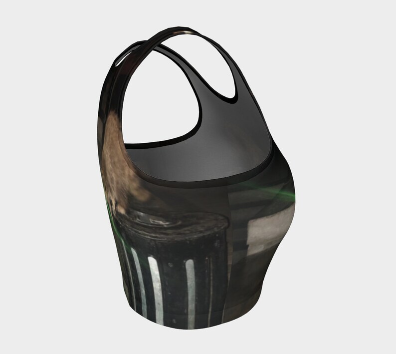 May include: Black and green crop top with a graphic print of a trash can with white stripes.