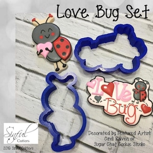 May include: A set of three blue plastic cookie cutters shaped like a ladybug, a heart, and the words "Love Bug".