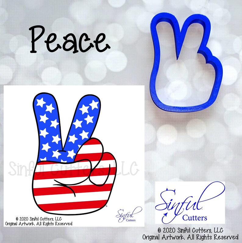 May include: Peace sign cookie cutter with an American flag design. The cutter is blue and has a peace sign shape with two fingers raised. The peace sign is decorated with red and white stripes and white stars.