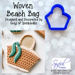 May include: A blue plastic cookie cutter in the shape of a woven beach bag. The text "Woven Beach Bag" is above the cutter. The text "Designed and Decorated by Geeji of Sprinkledbz" is below the cutter.