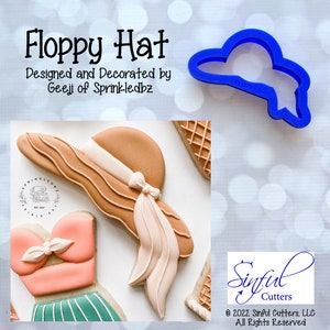 May include: A blue plastic cookie cutter shaped like a floppy hat. The cutter is labeled "Floppy Hat".