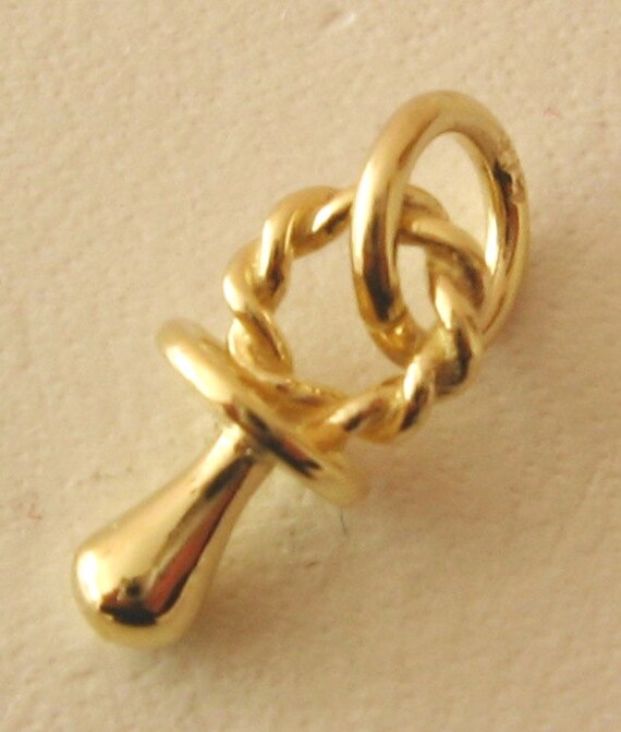 gold baby dummy