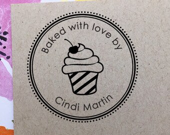 May include: A black and white circular stamp with the text "Baked with love by Cindi Martin" and a cupcake graphic.