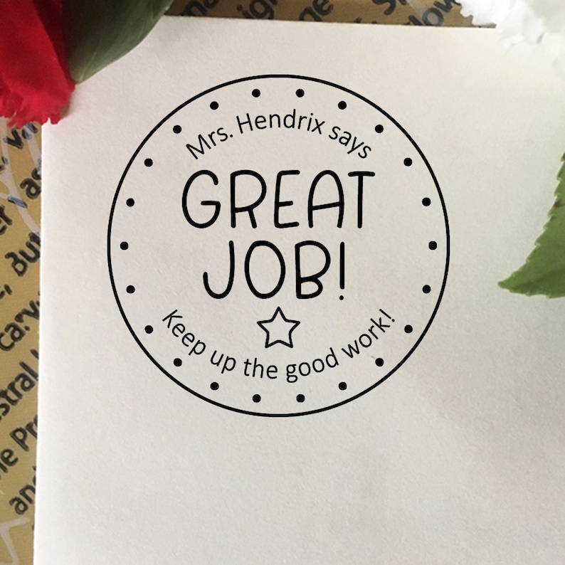May include: Black and white round sticker with the text "Mrs. Hendrix says GREAT JOB! Keep up the good work!"