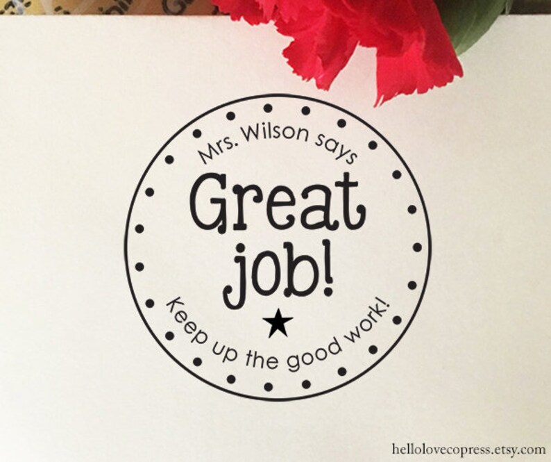 May include: Black and white round sticker with the text "Mrs. Wilson says Great job! Keep up the good work!" and a star in the centre.