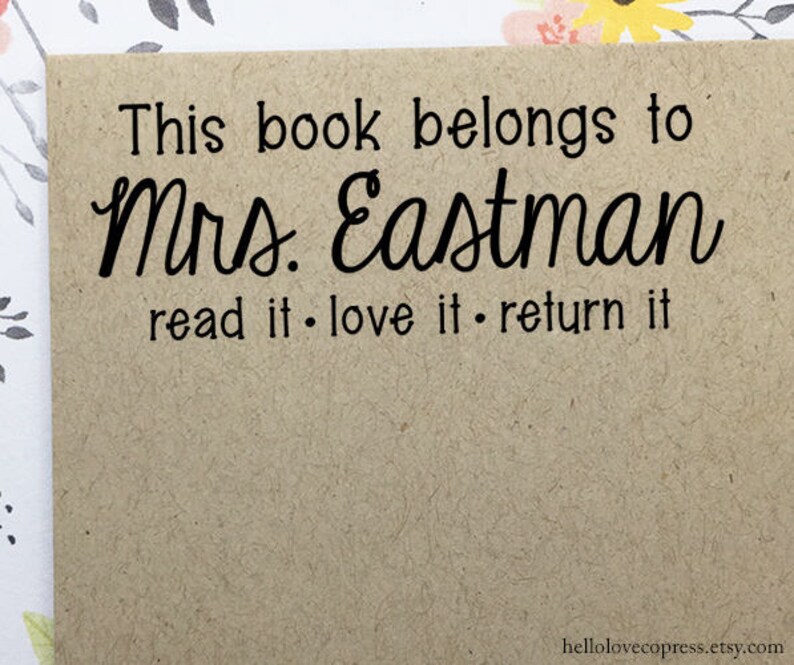May include: A brown paper card with the text "This book belongs to Mrs. Eastman read it. love it. return it" printed in black.