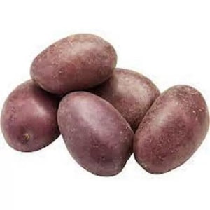 May include: Five purple potatoes, some with a slightly reddish hue, are arranged in a pile. The potatoes are smooth and oval-shaped.