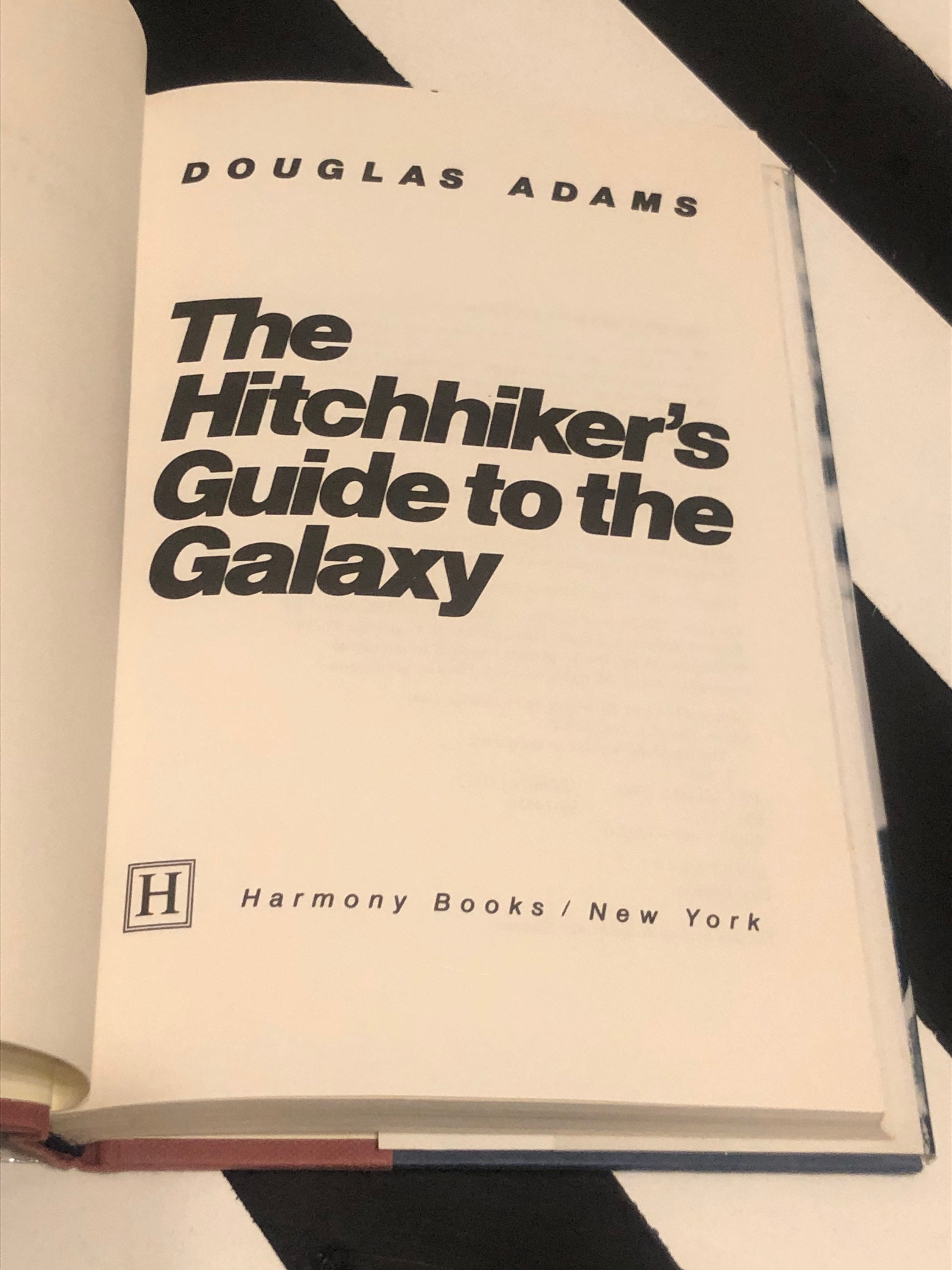 The Hitchhiker's Guide to the Galaxy by Douglas Adams (1979) first
