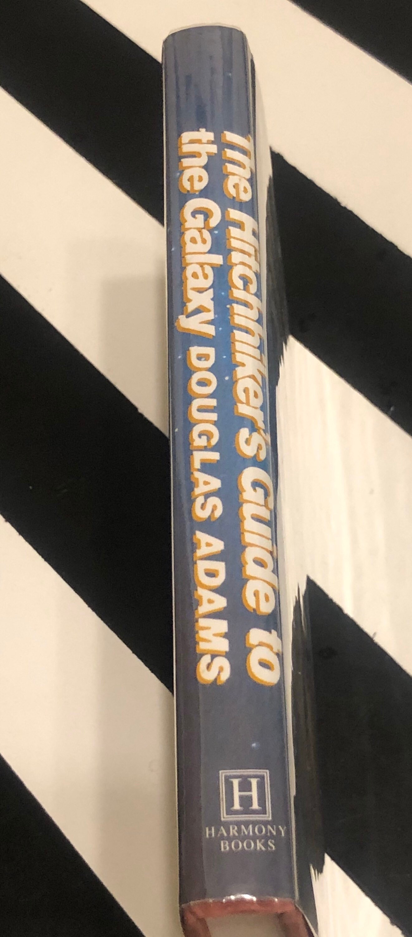 The Hitchhiker's Guide to the Galaxy by Douglas Adams (1979) first