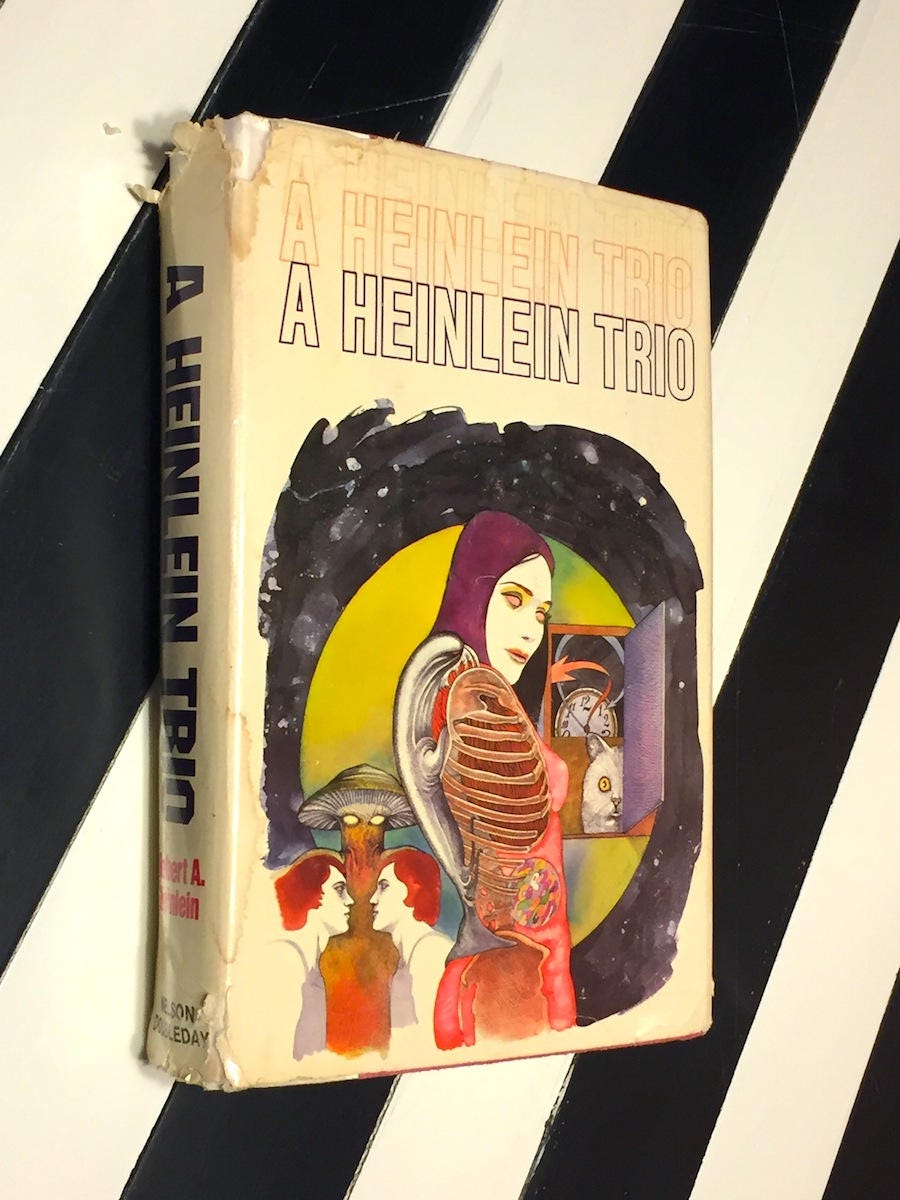 A Heinlein Trio by Robert Heinlein (1957) hardcover book