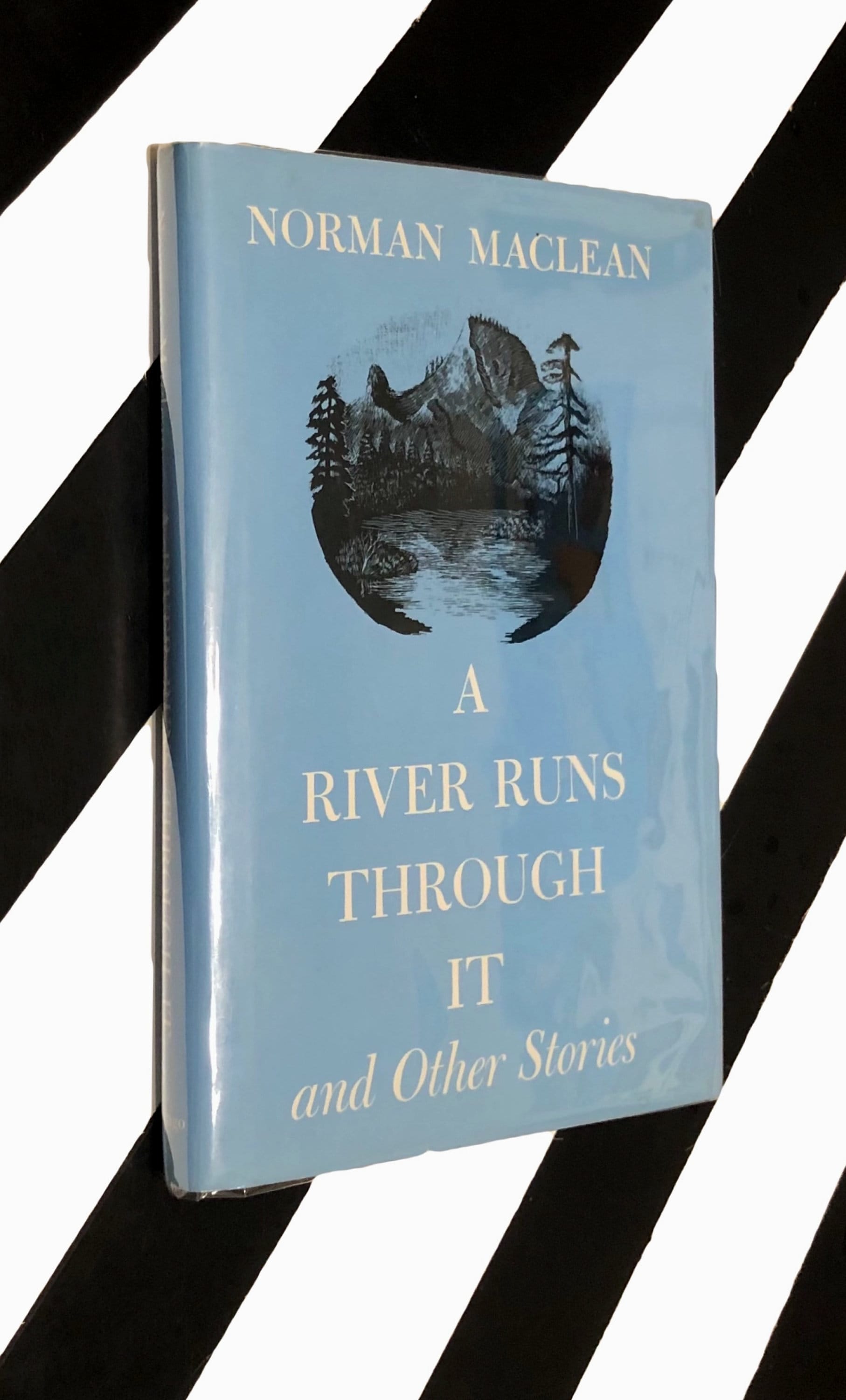 A River Runs Through it by Norman Maclean (1976) hardcover book