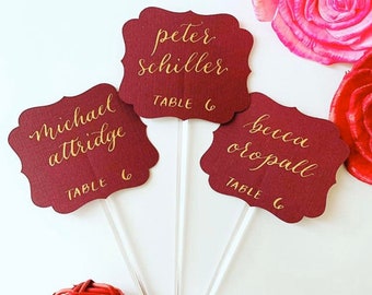 Calligraphy Burgundy Floral Banner Place Cards Stirrers | Sip and Be Seated Wedding Theme | Burgundy Champagne Flute Glass Escort Cards.