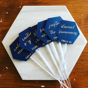 Navy Hexagon Cocktail Stirrers Place Cards | Champagne Flute Glass Escort Cards | Sip and Be Seated Wedding Theme | Calligraphy Place Cards.