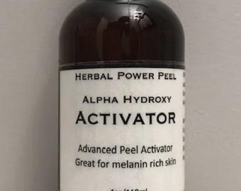 May include: A dark brown plastic bottle with a black cap and a white label. The label reads: HERBAL POWER PEEL, ALPHA HYDROXY ACTIVATOR, Advanced Peel Activator, Great for melanin rich skin, 4oz/118ml. The bottle contains a liquid skincare product.