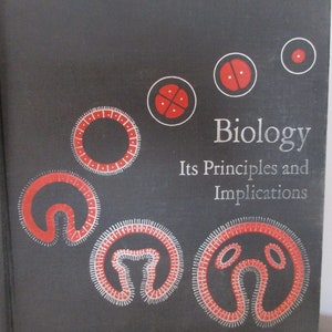 May include: A black book cover with the title "Biology: Its Principles and Implications" in white text. The cover features red and white illustrations of cells.