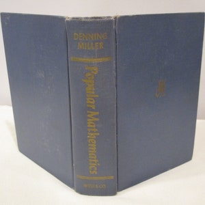 May include: A blue hardcover book titled "Popular Mathematics" by Denning Miller. The book is published by W.H. Freeman and Company.