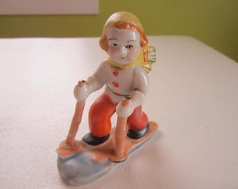 Skiing,downhill skiing,skier ceramic figurine,female skier,1950s made in Japan,skier figurine,cross county skier,winter decor, snow sports,