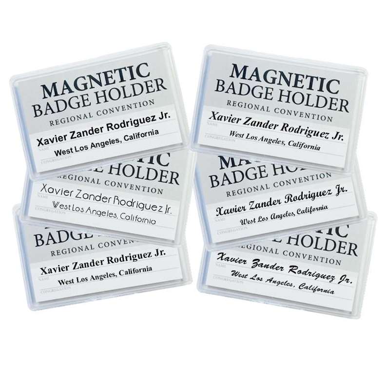 May include: Six clear plastic magnetic badge holders with the text "MAGNETIC BADGE HOLDER" and "REGIONAL CONVENTION" printed on them. Each holder has the name "Xavier Zander Rodriguez Jr." and the location "West Los Angeles, California" printed on a white card inside.