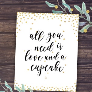 May include: White printable sign with gold glitter confetti and the text "all you need is love and a cupcake".