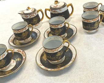 Juego de café/té Demitasse negro de 15 piezas estilo vintage con detalles dorados y motivos asiáticos.