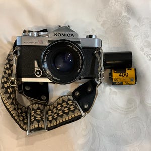 Konica Autoreflex T3 Black SLR W/hexanon AR 50mm F/1.7 F W